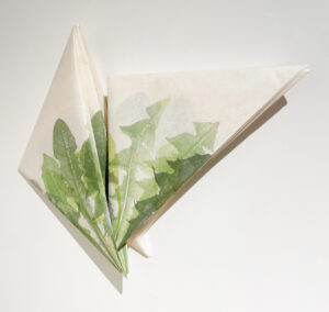 Jenn Law - envoi (i could learn), 16" x 21" (installed dimensions), pair of folded screeprints of letterpress printed dandelion leaves, edition of 1, 2026